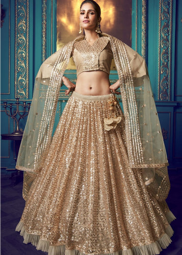 Golden Designer Soft Net Lehenga Choli with Ruffles and Sequin work Clothsvilla