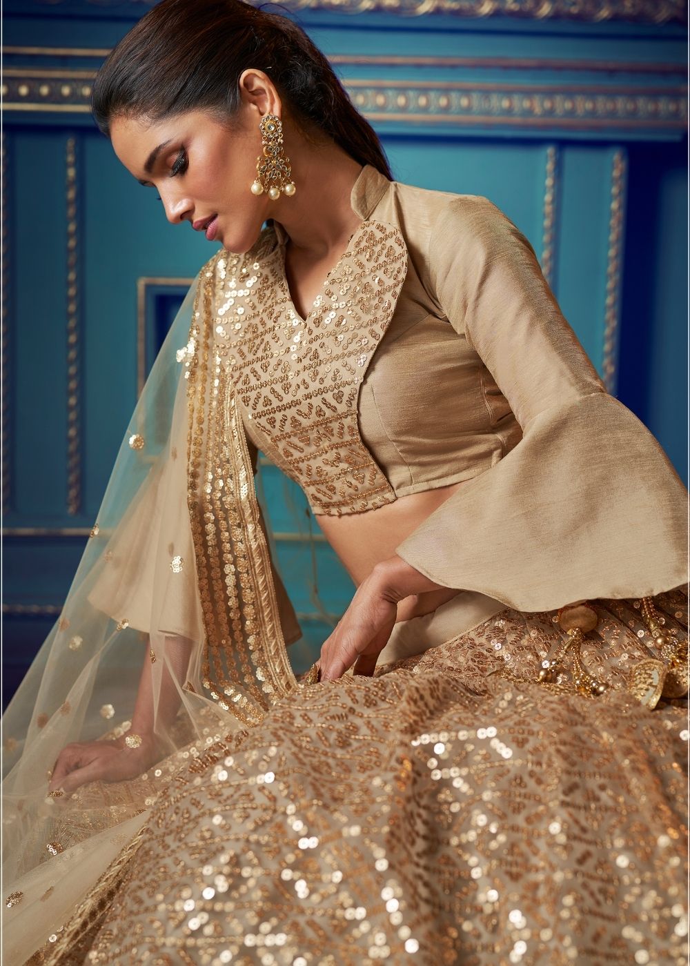 Golden Designer Soft Net Lehenga Choli with Ruffles and Sequin work Clothsvilla