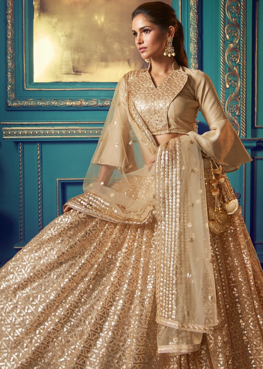 Golden Designer Soft Net Lehenga Choli with Ruffles and Sequin work Clothsvilla