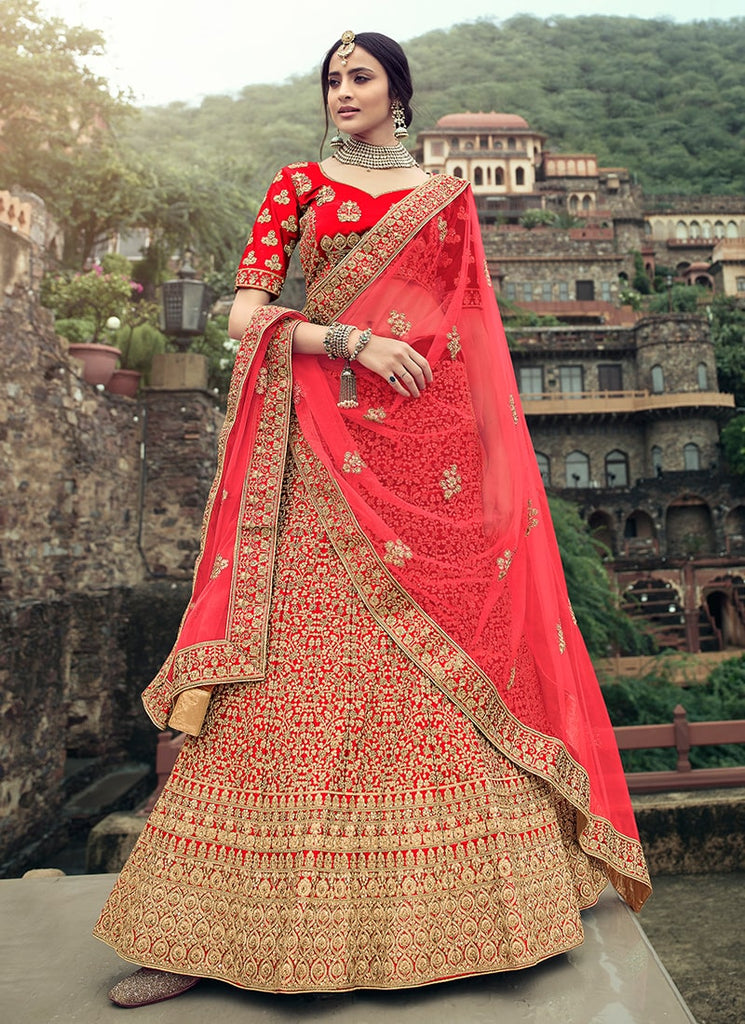Fascinating Golden And Red Bridal Lehenga at best price in Delhi