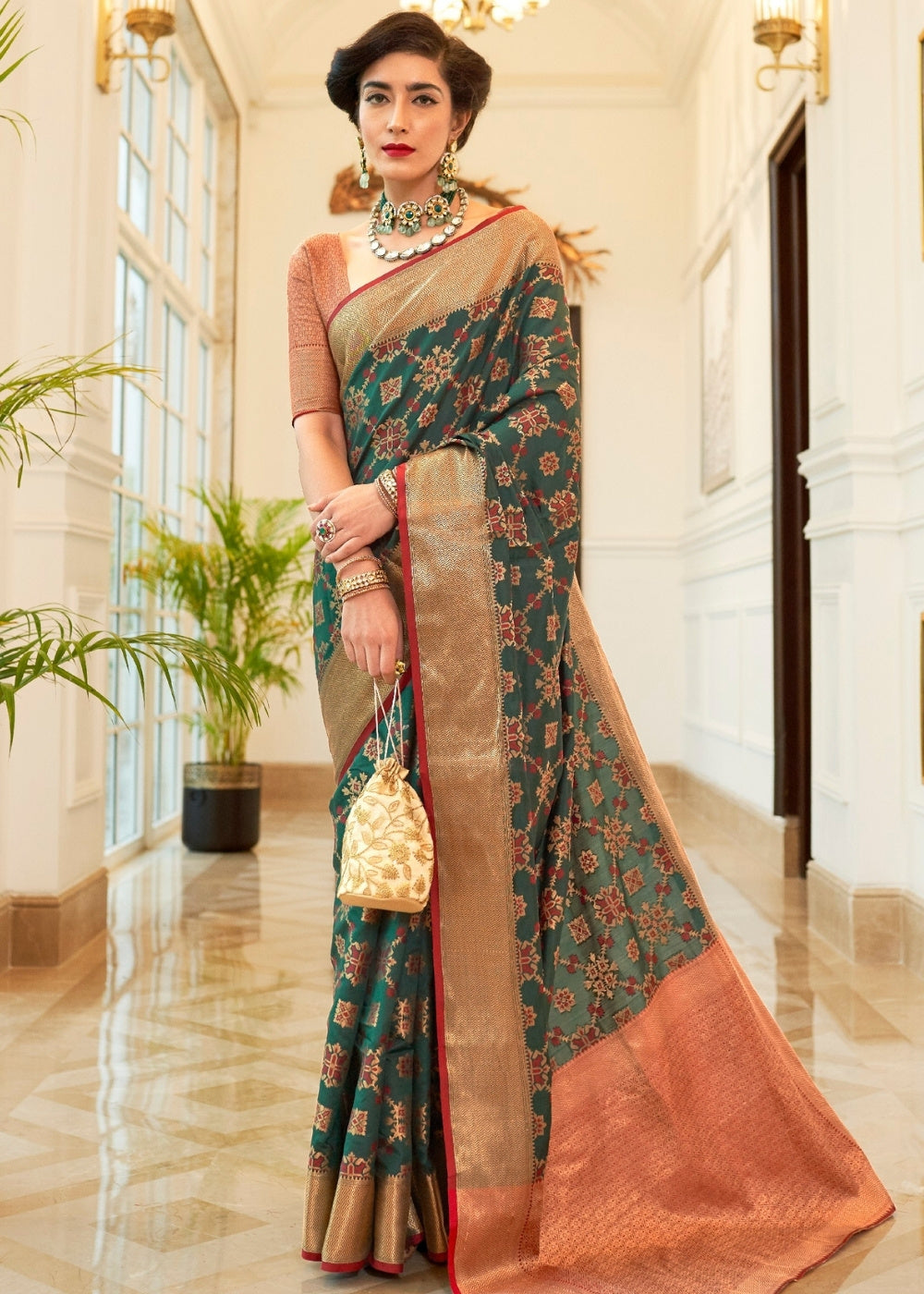 Dark Green Patola Silk Saree with Golden Border : Top Pick Clothsvilla