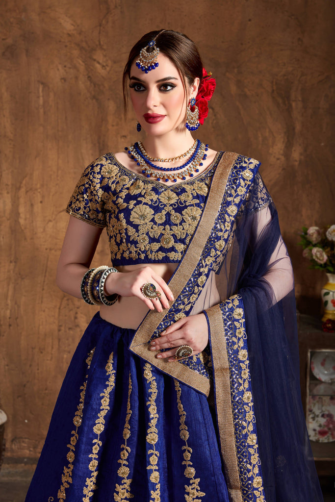 Agashe Multi-Designer Store - This stunning navy blue lehenga skirt in silk  with Cutdana, sequins, beads and Swarovski embroidery details paired with a  matching blouse and net base dupatta. This gorgeous set