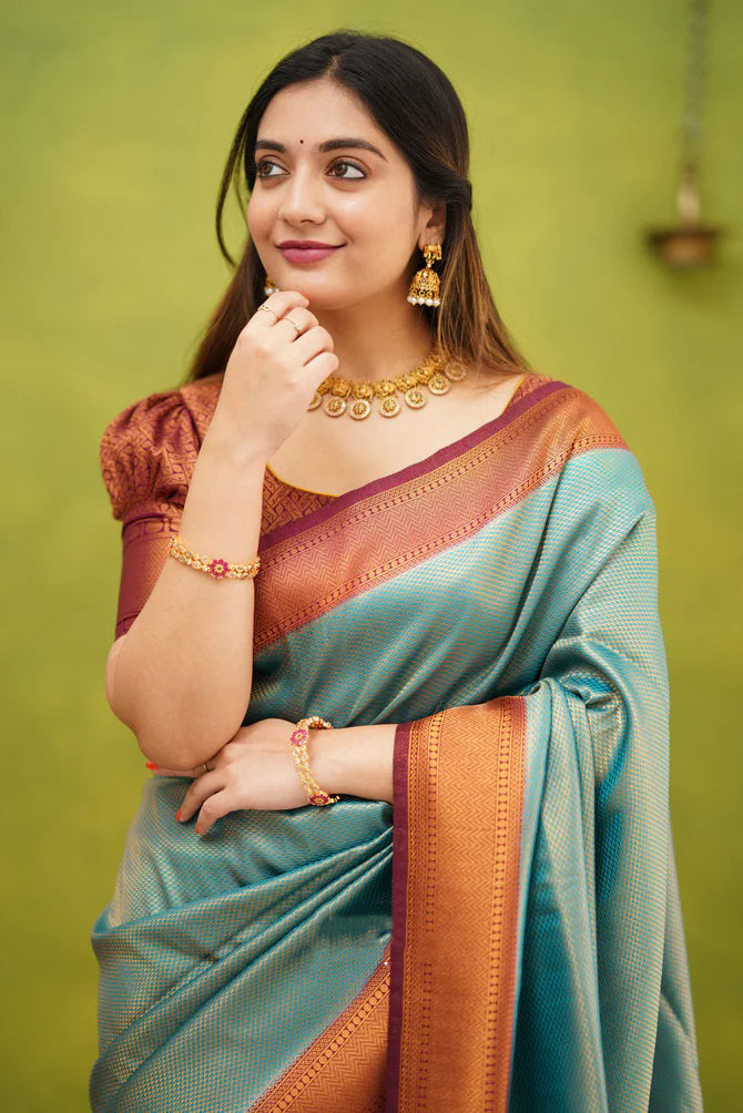 Embrocation Firozi Soft Banarasi Silk Saree With Ephemeral Blouse Piece ClothsVilla