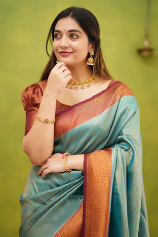 Embrocation Firozi Soft Banarasi Silk Saree With Ephemeral Blouse Piece ClothsVilla