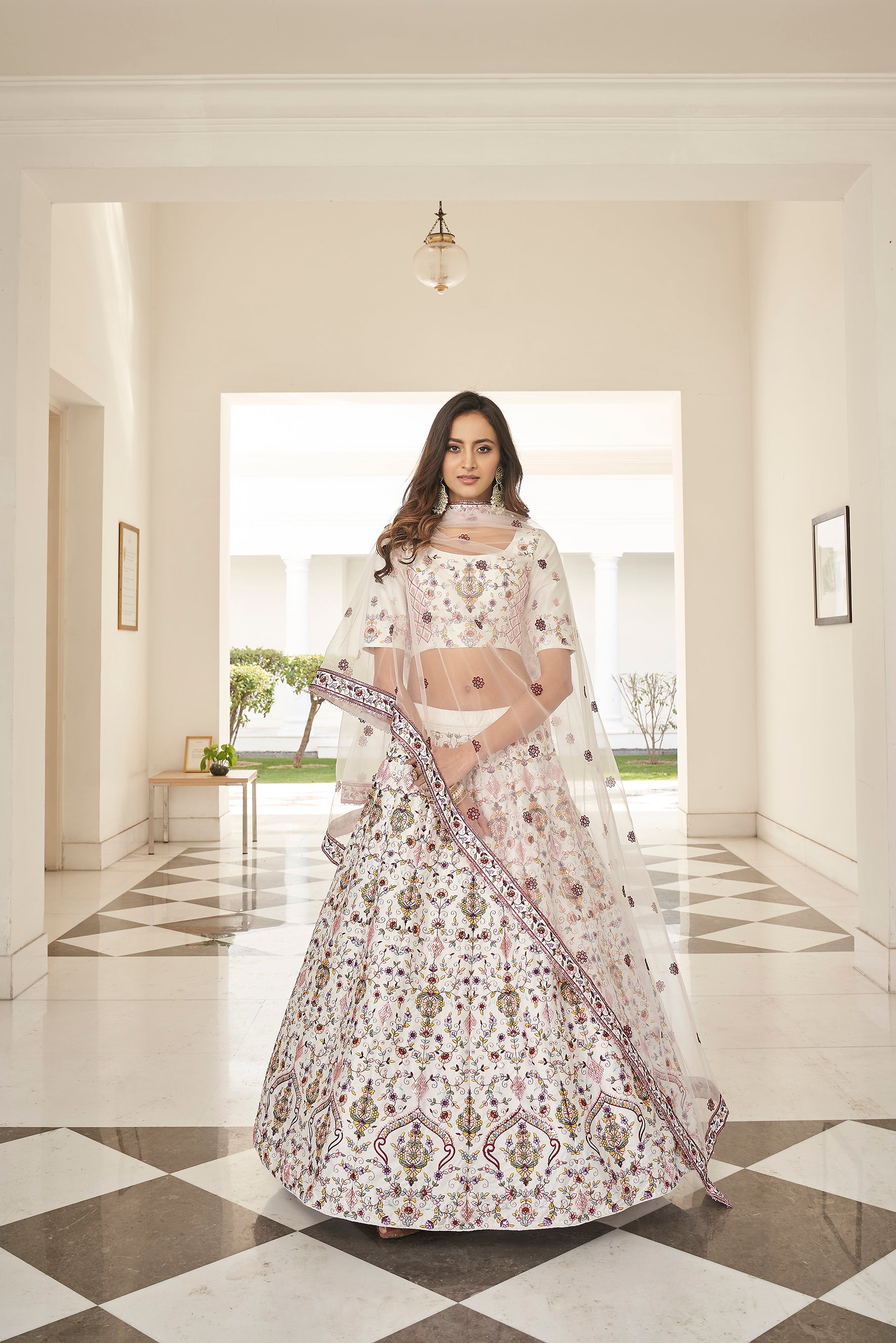 Fascinating White Embroidered Silk Party Wear Lehenga Choli ClothsVilla Main image