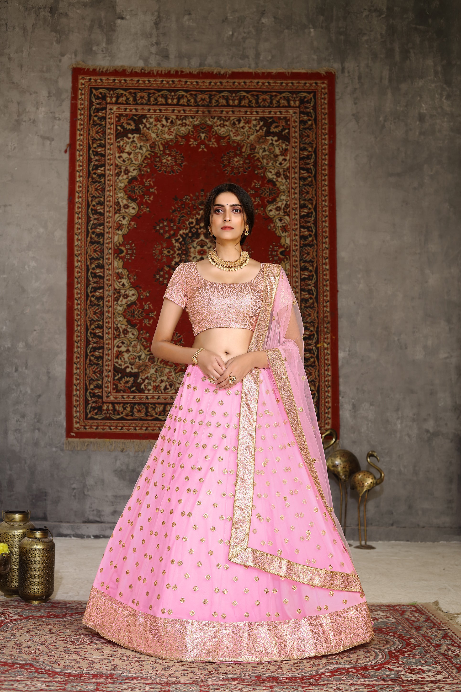 Hypnotizing Pink Sequins Embroidered Net Semi Stitched Lehenga Choli ClothsVilla Main image