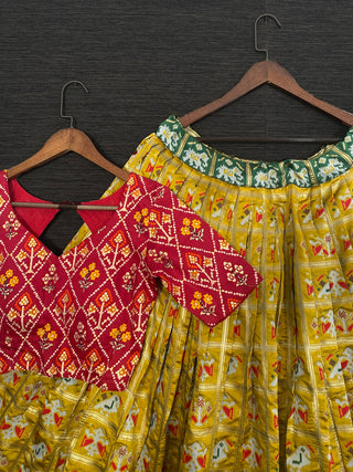 Mustard Color Jacquard Patola Lehenga Choli With Bandhej Silk Dupatta Clothsvilla