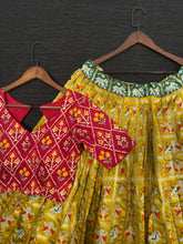 Load image into Gallery viewer, Mustard Color Jacquard Patola Lehenga Choli With Bandhej Silk Dupatta Clothsvilla