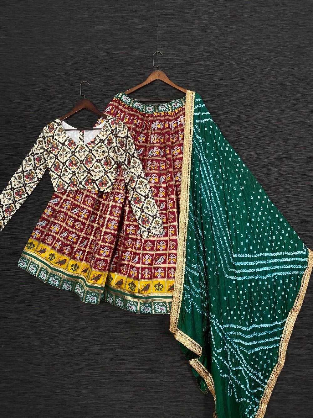Maroon Color Jacquard Patola Navratri Lehenga Choli With Bandhej Dupatta Clothsvilla Main image