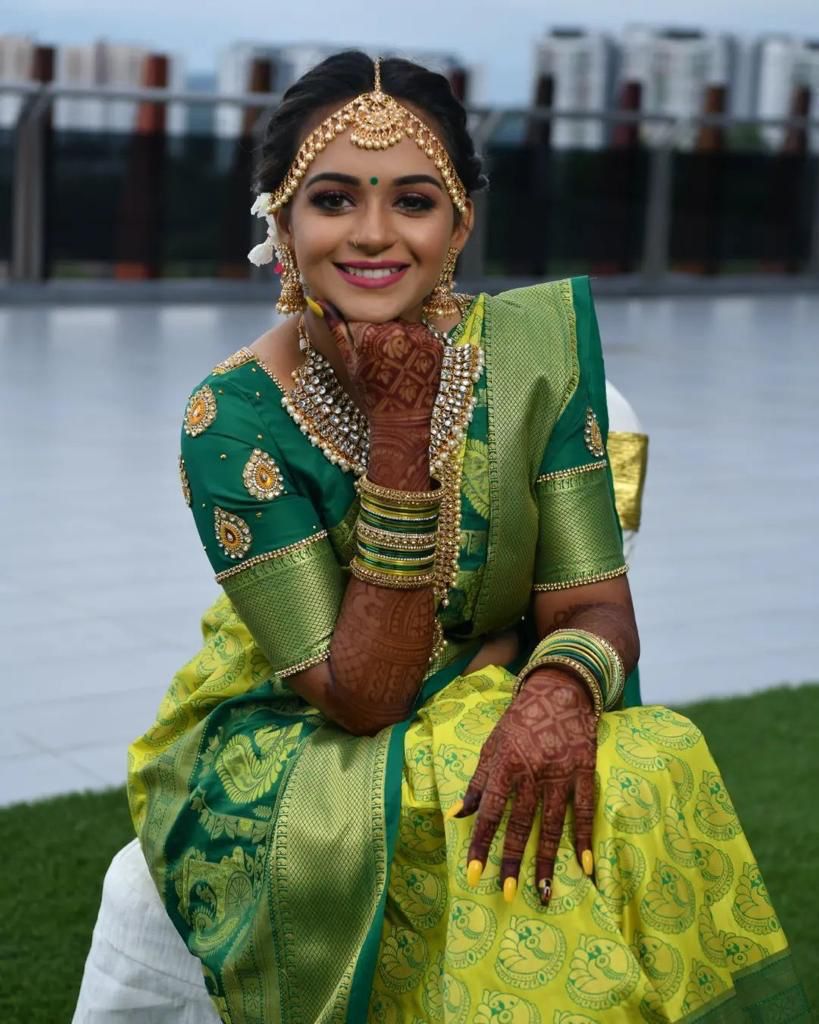 Mustard yellow silk saree with green cutwork embroidery and mirrorwork