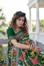 Load image into Gallery viewer, Lovable Green Weaving Patola Silk Wedding Wear Saree ClothsVilla