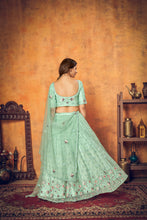 Load image into Gallery viewer, Mint Green Thread Embroidered Net Festival Lehenga Choli ClothsVilla