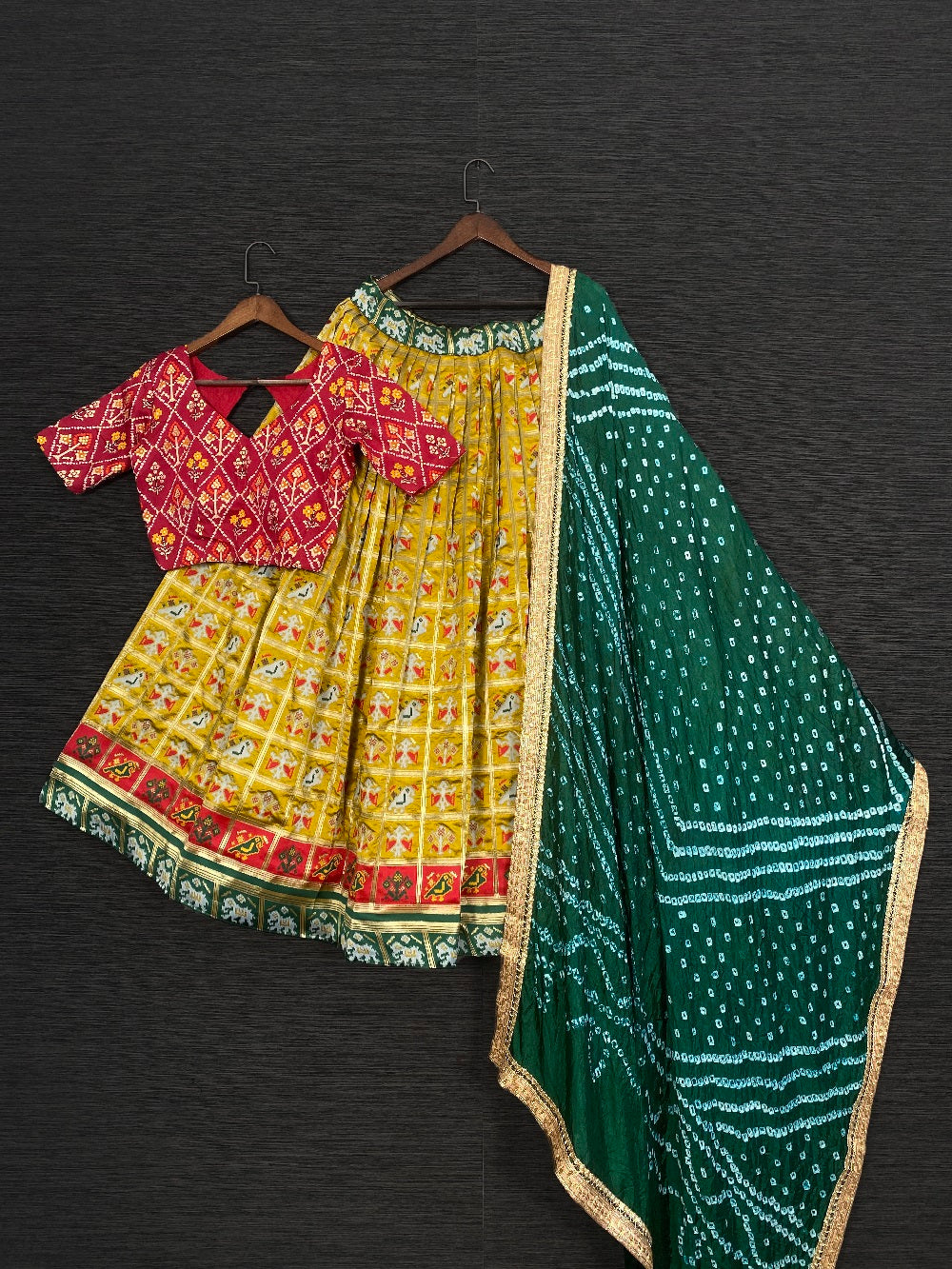 Mustard Color Jacquard Patola Lehenga Choli With Bandhej Silk Dupatta Clothsvilla