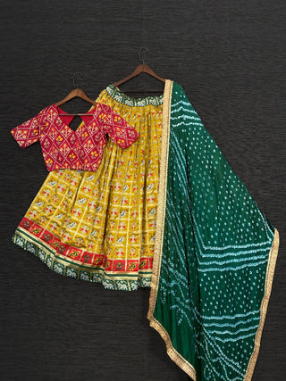Mustard Color Jacquard Patola Lehenga Choli With Bandhej Silk Dupatta Clothsvilla