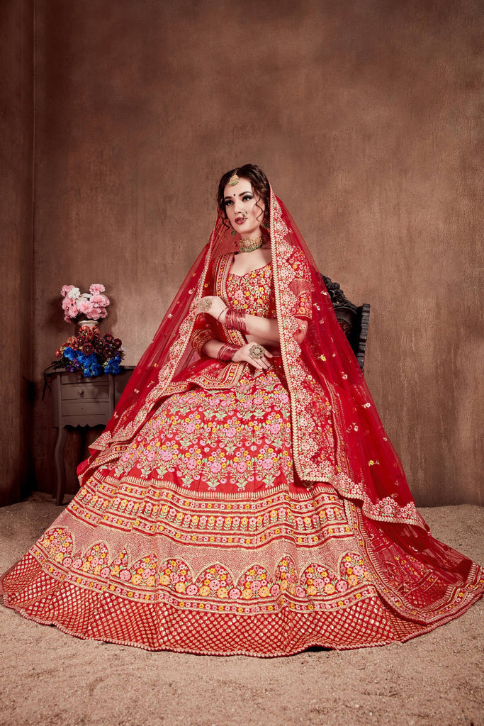 Flattering Red Colored Designer Bridal wear Embroidered Lehe Flattering Red Colored Designer Bridal wear Embroidered Lehe