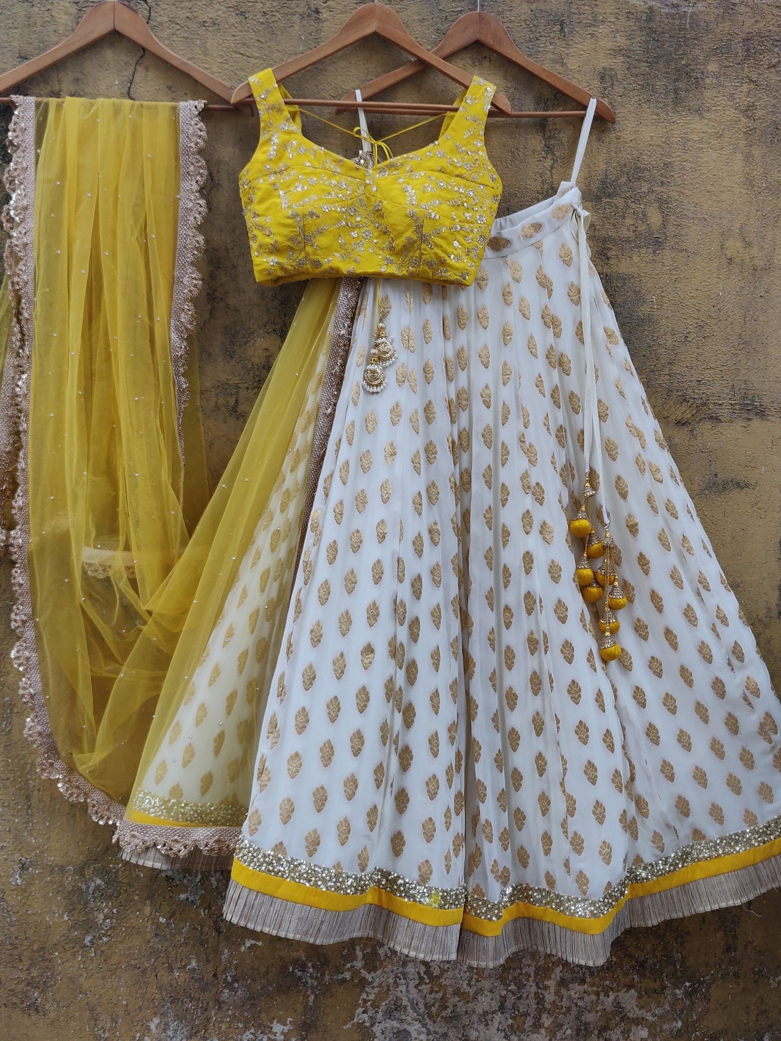 White color Banarasi Silk Lehenga Choli with Yellow Net Dupatta ClothsVilla