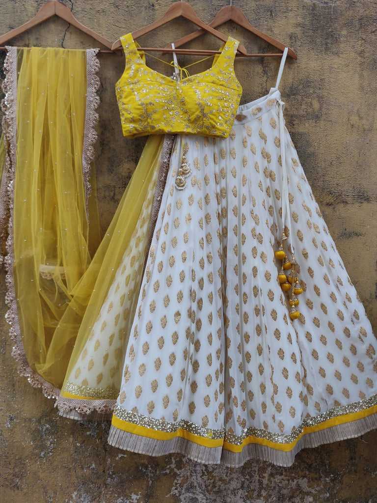 White color Banarasi Silk Lehenga Choli with Yellow Net Dupatta ClothsVilla