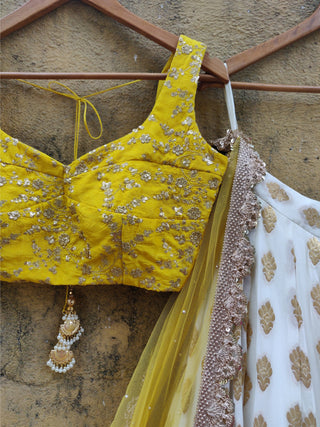 White color Banarasi Silk Lehenga Choli with Yellow Net Dupatta ClothsVilla