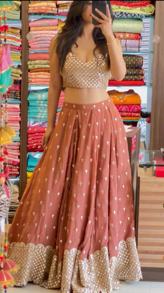 Photo of Bride in bright peach lehenga with green necklace | Couple wedding  dress, Indian wedding outfits, Couple outfits