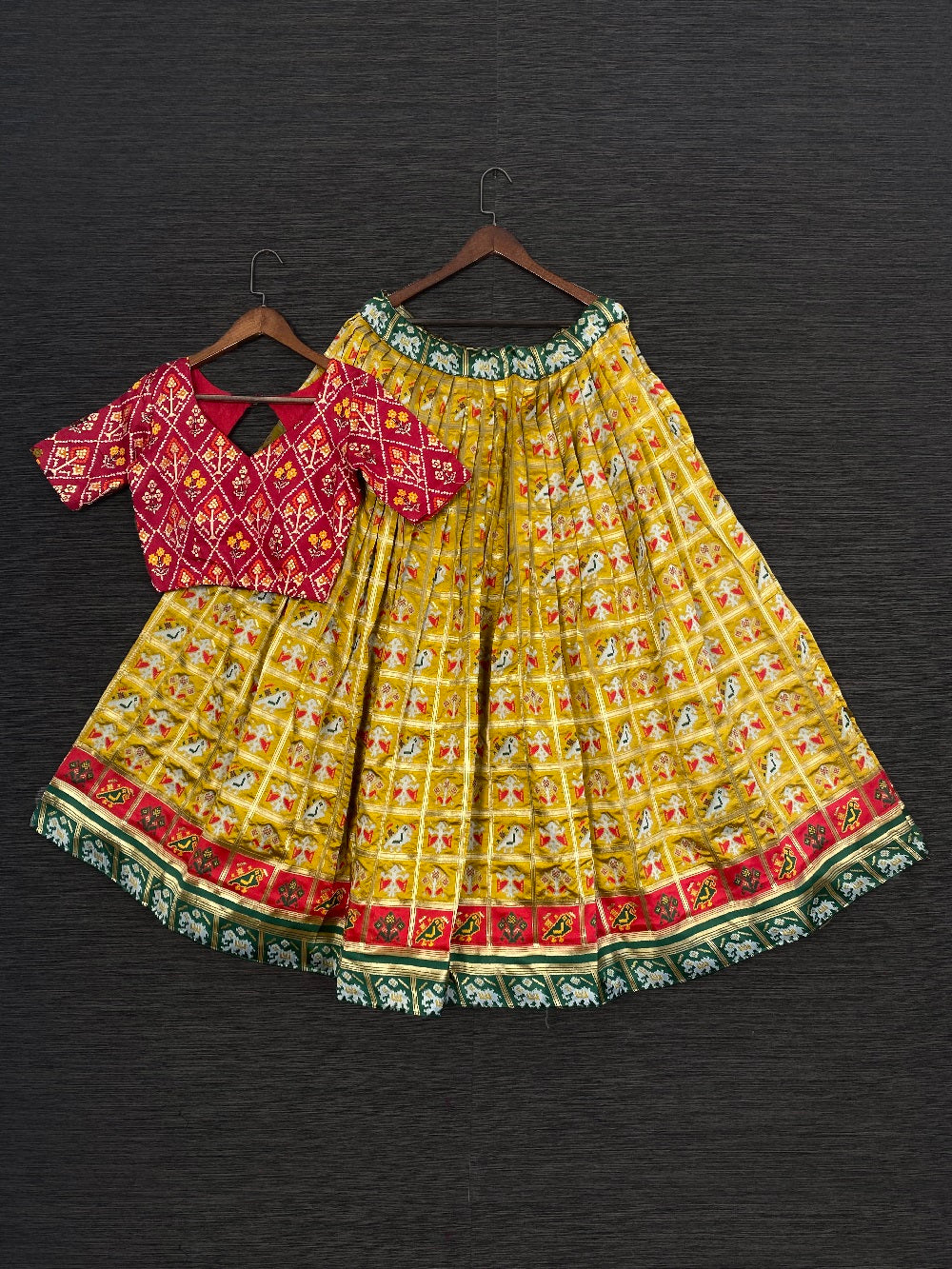 Mustard Color Jacquard Patola Lehenga Choli With Bandhej Silk Dupatta Clothsvilla