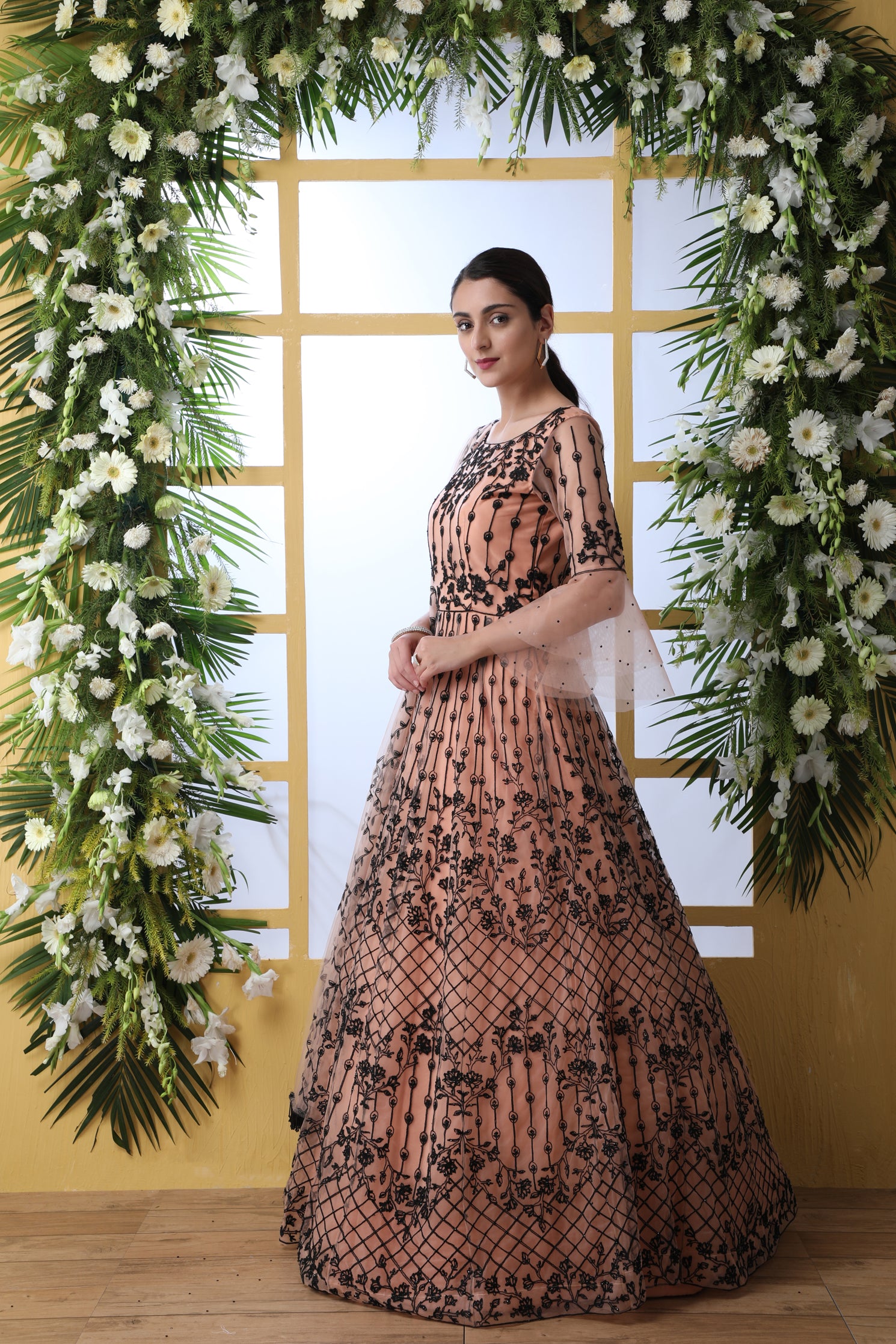 Sensational Peach Colored Soft Net Base Festive Wear Designer Gown ClothsVilla