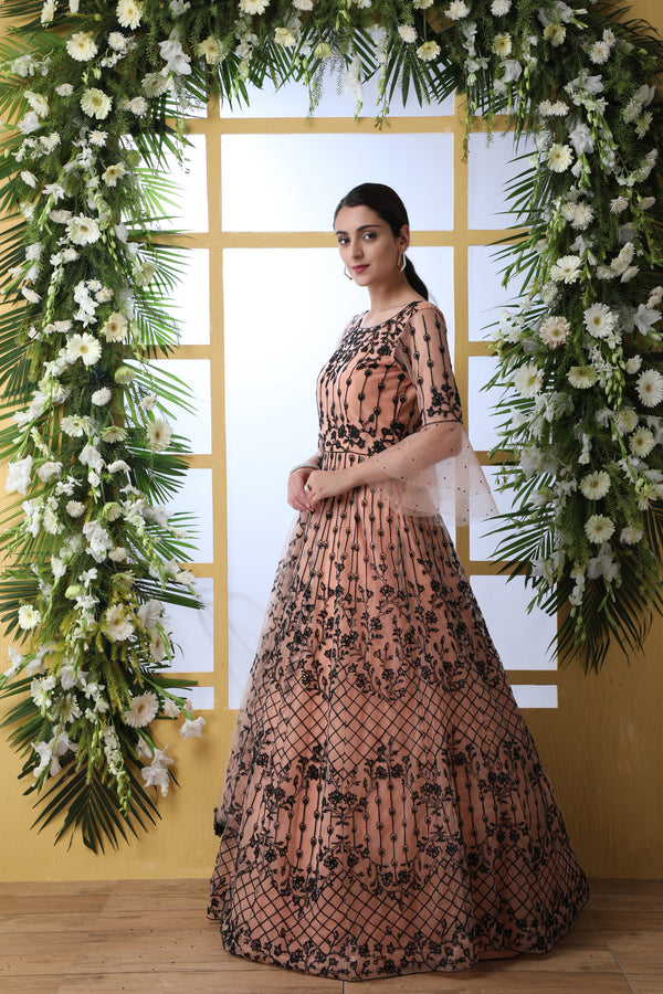 Sensational Peach Colored Soft Net Base Festive Wear Designer Gown ClothsVilla