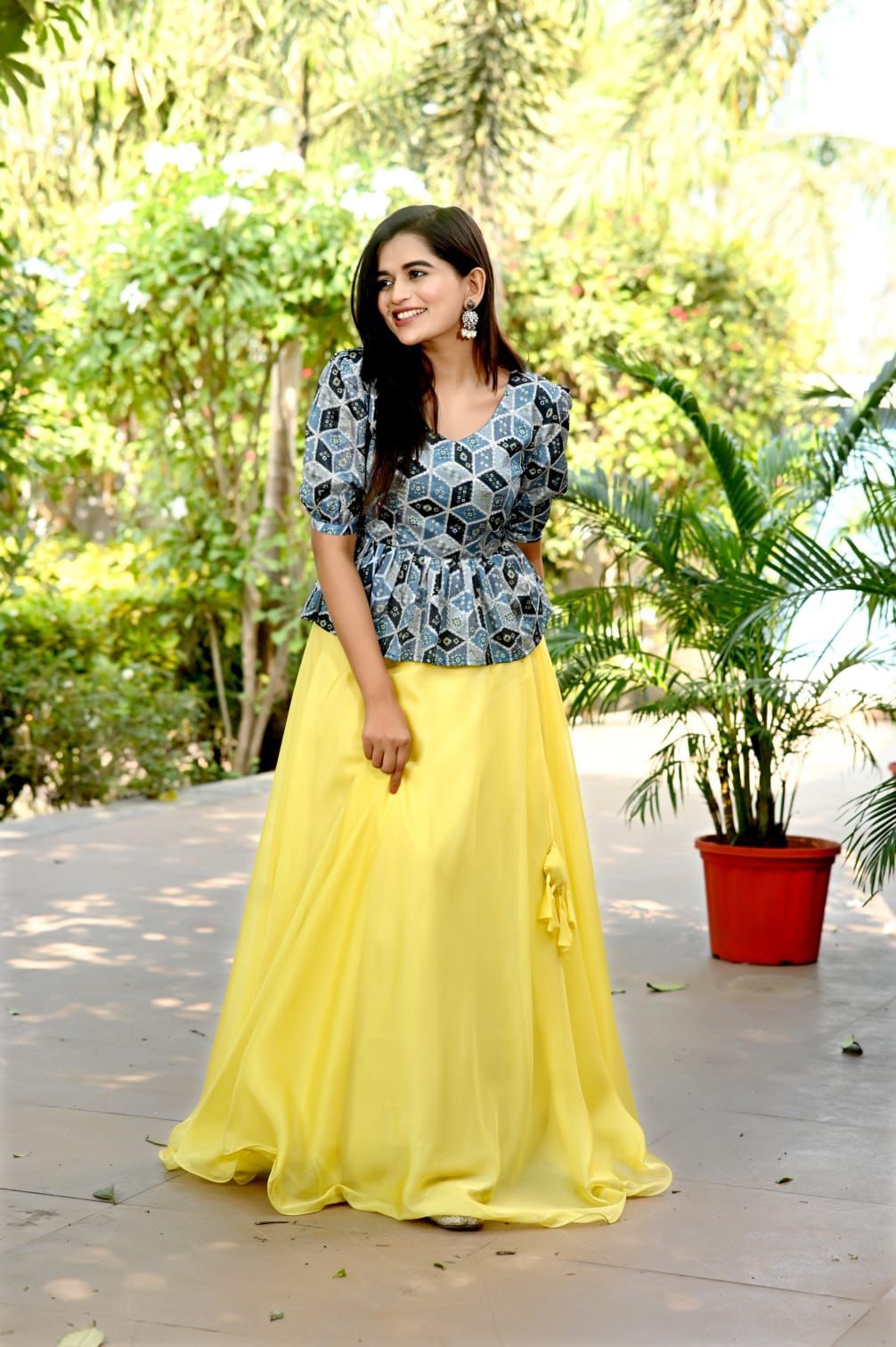 blue top and yellow skirt