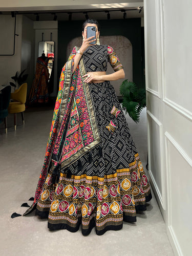 Black Color Bandhej And Patola Print With Foil Work Tussar Silk Lehnga Choli Clothsvilla