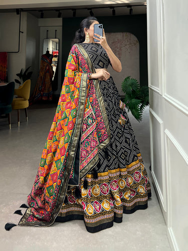 Black Color Bandhej And Patola Print With Foil Work Tussar Silk Lehnga Choli Clothsvilla