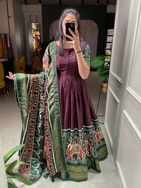 Brown Color Patola And Foil Printed Dola Silk Gown Clothsvilla Main image