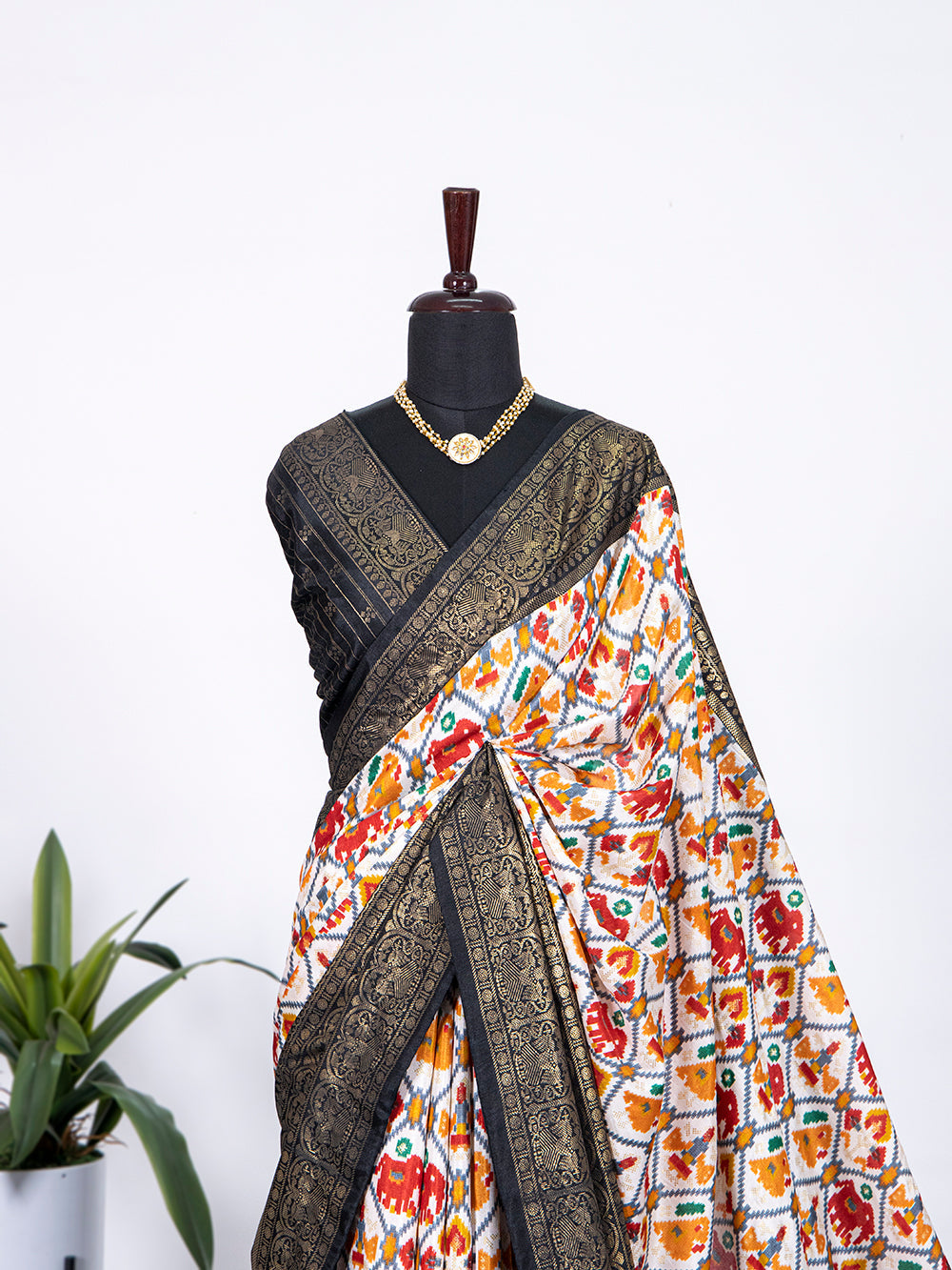 Black Color Patola Print with Foil Work Dola Silk Saree Clothsvilla