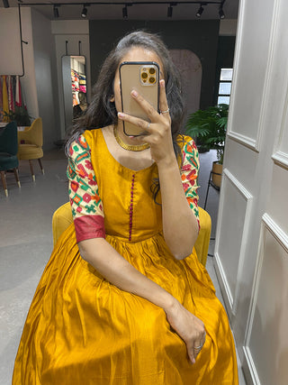 Yellow Color Foil Printed Dola Silk Gown Clothsvilla