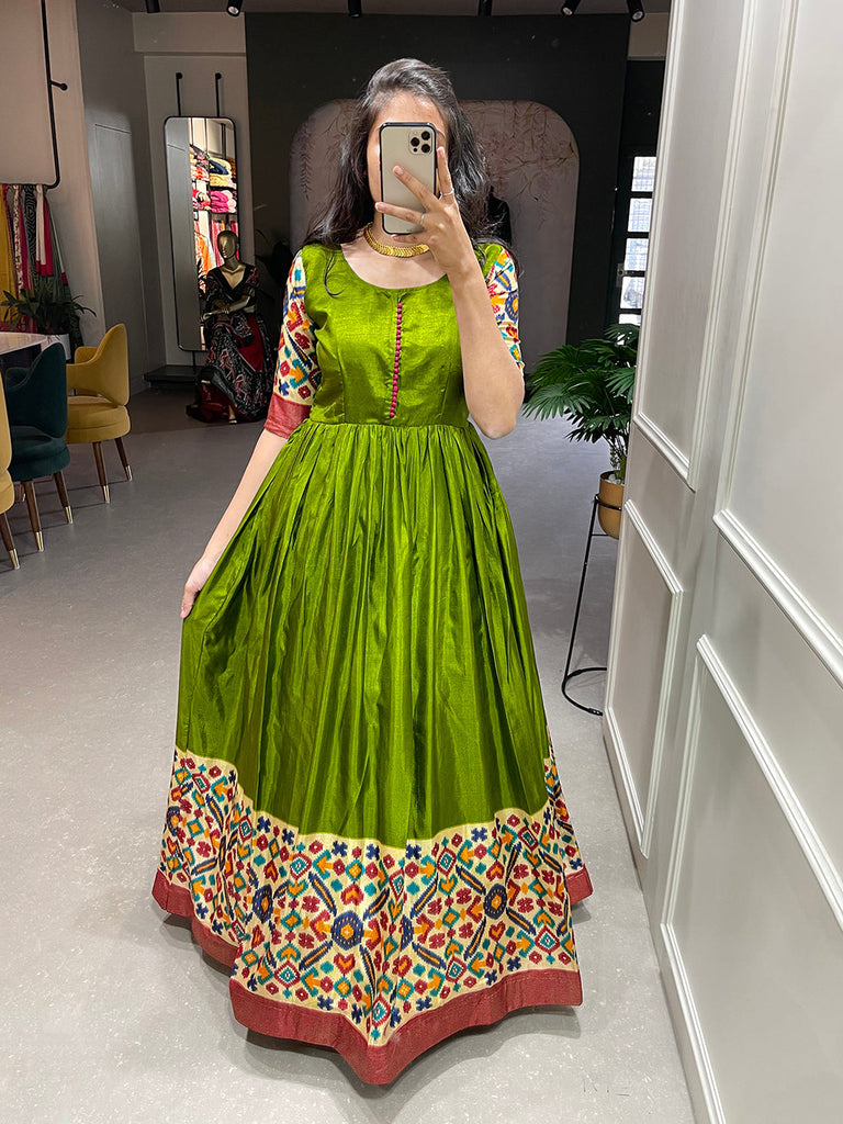 Mehendi Color Foil Printed Dola Silk Gown Clothsvilla