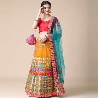 Mustard Partywear Embroidered & Mirror Work Heavy Soft Net Lehenga Clothsvilla