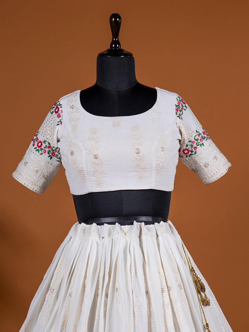 White Color Lucknowi Work Georgette Lehenga Choli With Green Bandhani Dupatta Clothsvilla