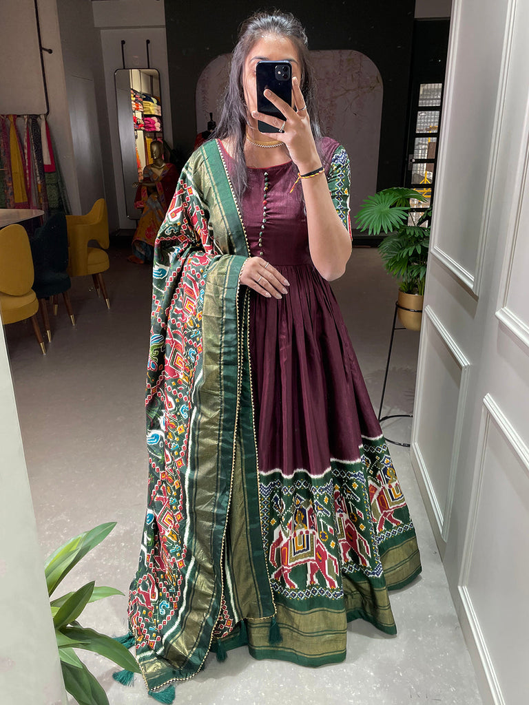 Brown Color Patola And Foil Printed Dola Silk Gown Clothsvilla