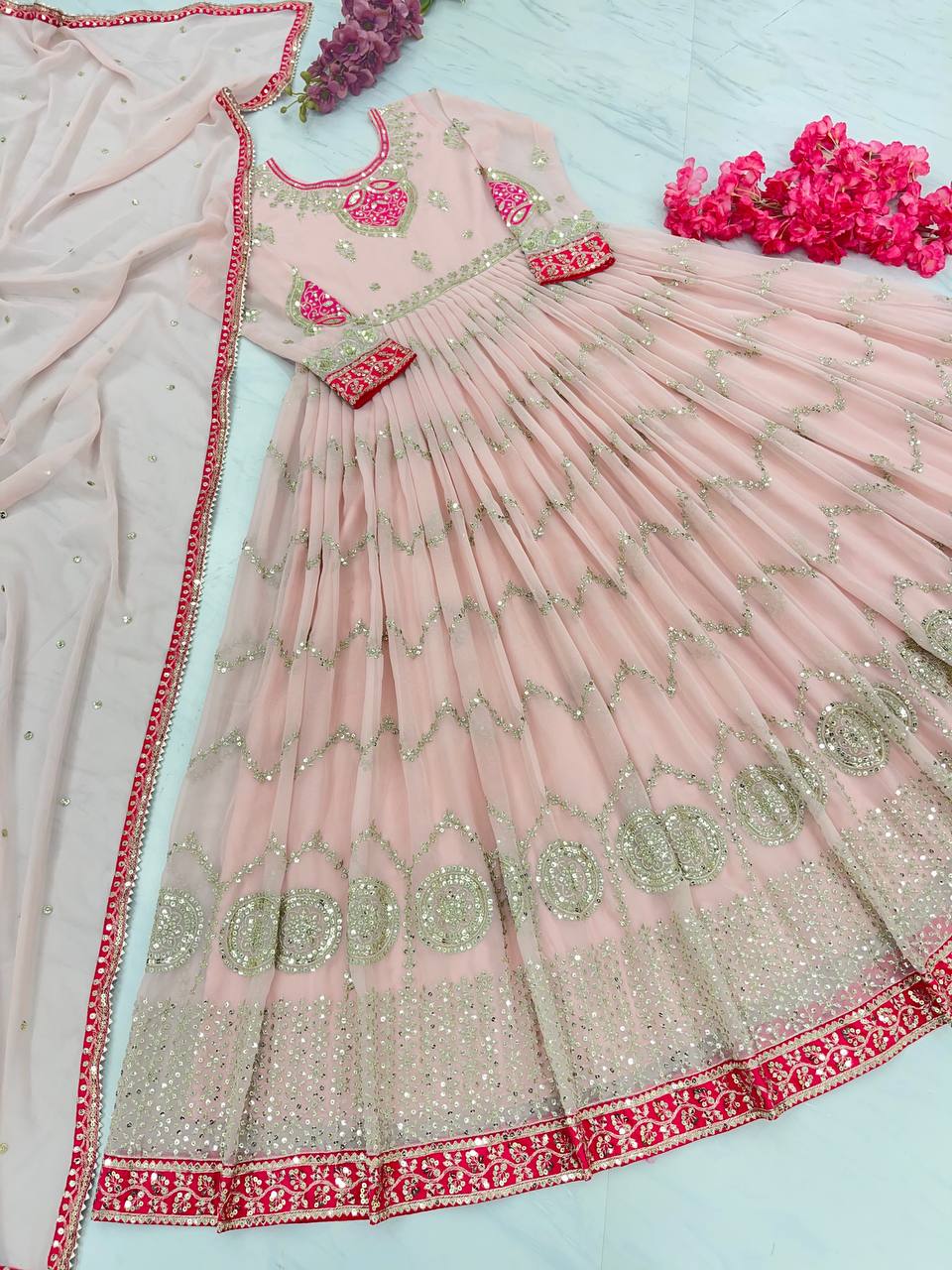 Mesmerizing Sequence Work Peach Color Gown Clothsvilla
