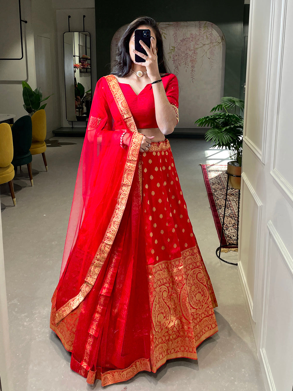 Photo of Gold embroidered lehenga with contrasting red dupatta