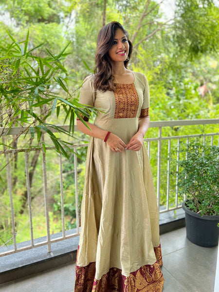 Chiku Color Weaving Zari Work Silk Gown - Main Image