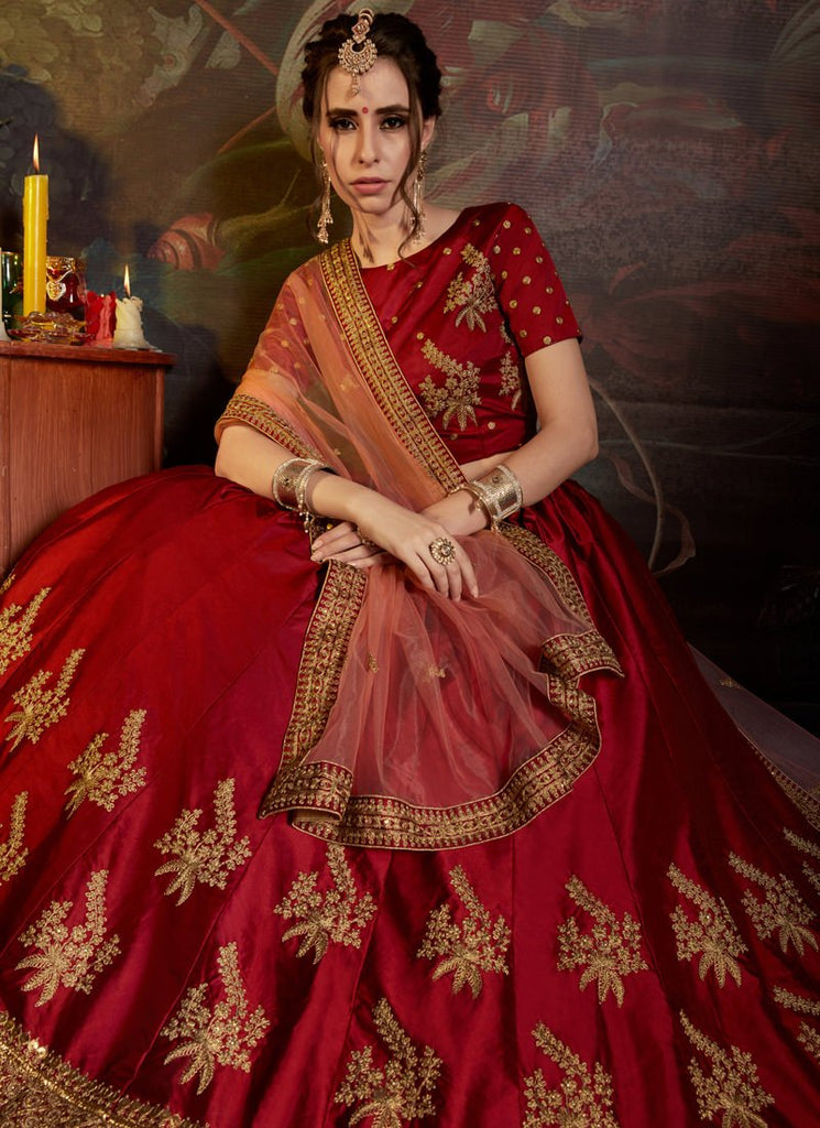 MAROON AND IVORY ABSTRACT PRINTED LEHENGA SET AND A MATCHING ZARI WORK  BLOUSE PAIRED WITH A MATCHING DUPATTA AND SILVER EMBELLISHMENTS. - Seasons  India